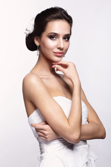 Wall Mural - Portrait of beautiful young brunette woman bride in white Wedding dress