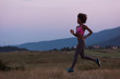 © .shock - Young African american woman jogging in nature