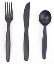 Black Plastic Fork, Knife And Spoon On A White Background. Vertical.