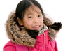 Portrait of young happy Asian girl in pink jacket with furry hood smiling,  murodo, Tateyama Kurobe Alpine, Japan. Asian model preteen in shocking pink down jacket Isolated on white background.
