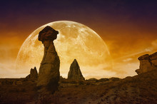 Rising Bloody Red Full Moon, Silhouettes Of Mushroom Rocks