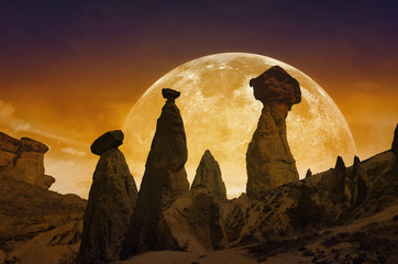 Poster - Rising bloody red full moon, silhouettes of mushroom rocks in Ca