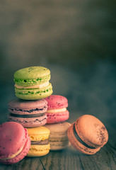 Wall Mural - Colorful macarons on the wooden background