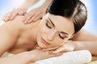 © Acronym - Portrait of a young woman relaxing on a massage