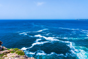 Wall Mural - Ocean wave background. Cliff coastline in Sagres, Algarve, Portu