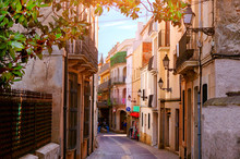 Beautiful View Of Scenic Narrow Alley Street With Historic Traditional Houses In An Old Town In Europe With Blue Sky And Clouds In Summer Sunny Day, With Retro Vintage Instagram Warm Filter Effect