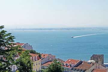 Wall Mural - Red roofs in Lisbon by the sea