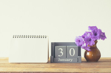 vintage wood calendar for january day 30 on wood table with empt