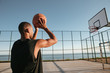 African basketball player throwing ball