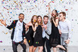 © Drobot Dean - Group of cheerful joyful young people standing and celebrating together