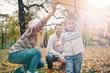 © chika_milan - Dad, mom and son flying a kite in nature