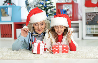 Canvas Print - Grandmother and child with gift