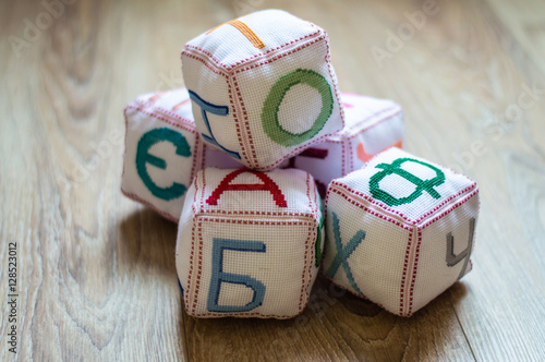 Fotografie, Obraz tissue blocks with embroidered letters of the Cyrillic alphabet