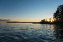 A Pier In Lake Vänern Against A Summer Sunset