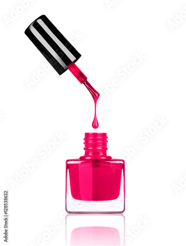 Fotografie, Obraz Nail polish dripping from brush into bottle on white background