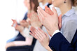 © rogerphoto - Close up of business people hands  clapping at conference