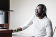 © santypan - Artist producing music in his home sound studio.