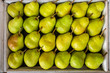 Tasty yellow pears in the box