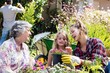 Grandmother, mother and daughter gardening together
