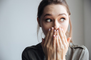 Wall Mural - Young surprised woman in shirt