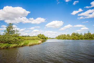 Sticker - Rippling water surface in a wide Dutch creek