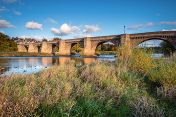 Sticker - River Tyne under Corbridge Road Bridge, originally built in the thirteenth century, the bridge at Corbridge allows crossing of the River Tyne