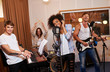 © Nejron Photo - Multiracial music band performing in a recording studio