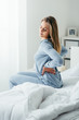 © StockPhotoPro - Woman with back pain