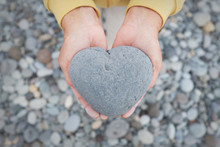 Holding Heart In Hands - Heart Shaped Stone