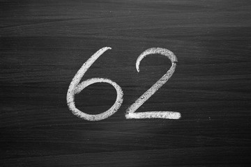 Wall Mural - number sixty two enumeration written with a chalk on the blackboard