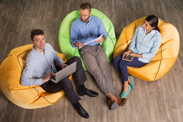 Business Team Working on Project on Beanbag Chairs