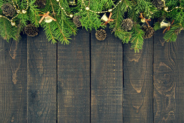 Wall Mural - Frame from decorated Christmas tree on rustic wooden background