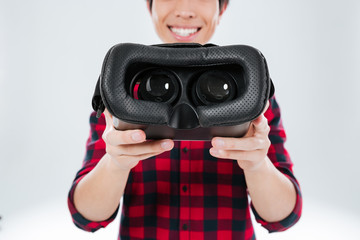 Poster - Man showing to camera virtual reality device