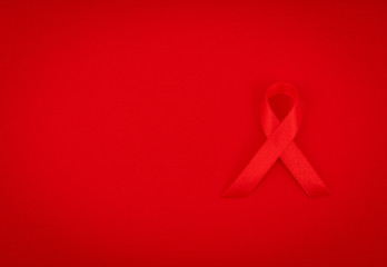 Wall Mural - Aids Awareness Red heart Ribbon on red background .