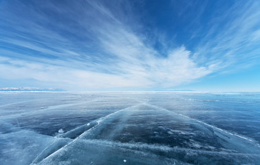  Frozen Lake Baikal. Beautiful stratus clouds over the ice surface on a frosty day. Natural background