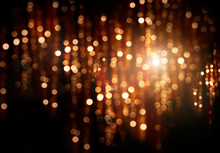 Christmas Holiday Glowing Backdrop. Defocused Golden Background With Blinking Stars