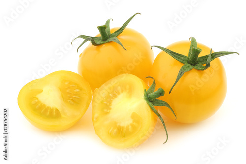fresh dutch yellow tasty tom tomatoes and a cut one on a white background Tablou Canvas