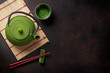 Green teapot and tea cups