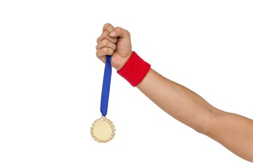 Athlete holding gold medal after victory