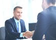 © ASDF - businessman shaking hands to seal a deal with his partner