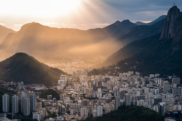 Fototapete - Sun is shining through the clouds on the Rio de Janeiro city, View from the Sugarloaf Mountain