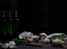 Still Life, Vintage. Mushrooms, Bottle, Greens On A Dark Wooden Table. Art, Old Paintings
