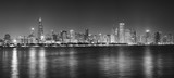 Fototapeta  - Black and white night panoramic picture of Chicago city skyline, USA.