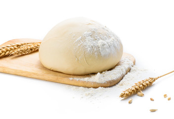 Wall Mural - Dough with ears of wheat isolated on white background