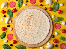 Raw Pizza Ingredients On Wooden Background, Top View