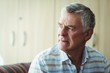 © WavebreakmediaMicro - Thoughtful senior man sitting in living room