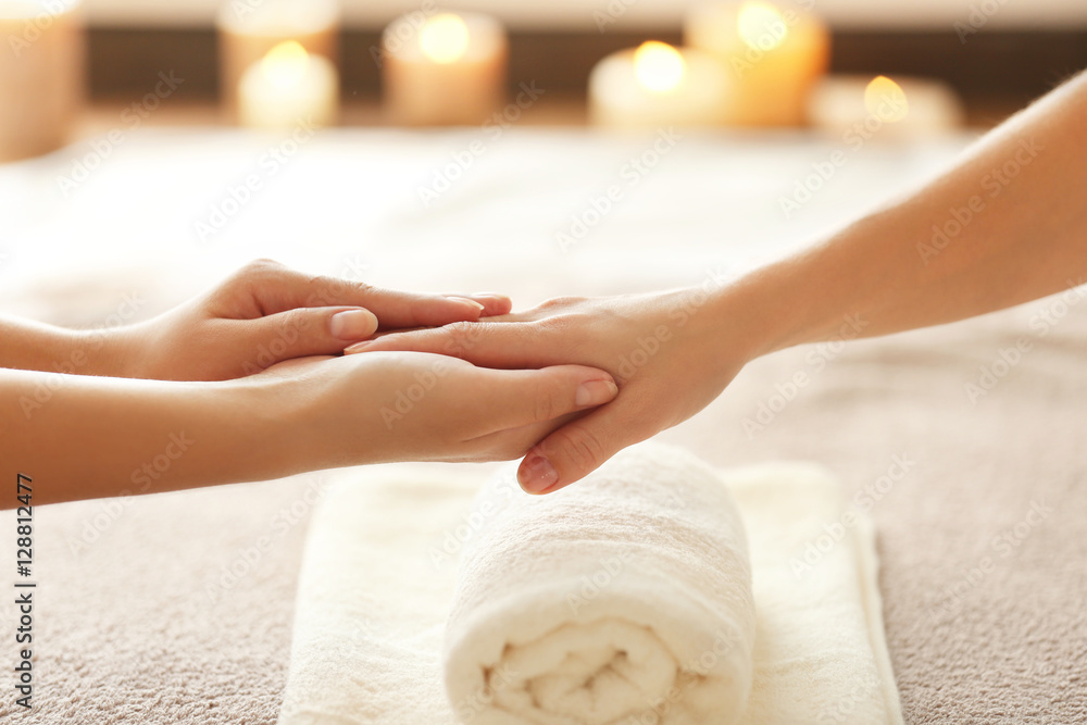 Spa concept. Specialist massaging female hand