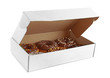 Tasty donuts in paper box on white background