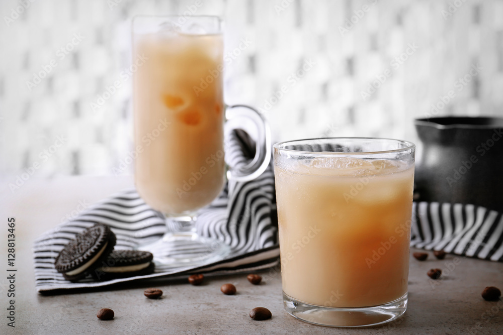 Iced coffee with milk on grey table Stock Photo | Adobe Stock