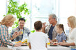 © Africa Studio - Happy large family having breakfast on kitchen